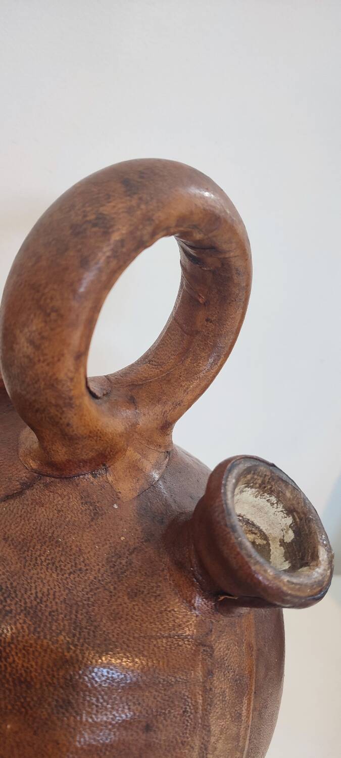 Gargoulette, terracotta jug covered with leather