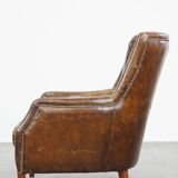 Grained cowhide armchair with a timeless design