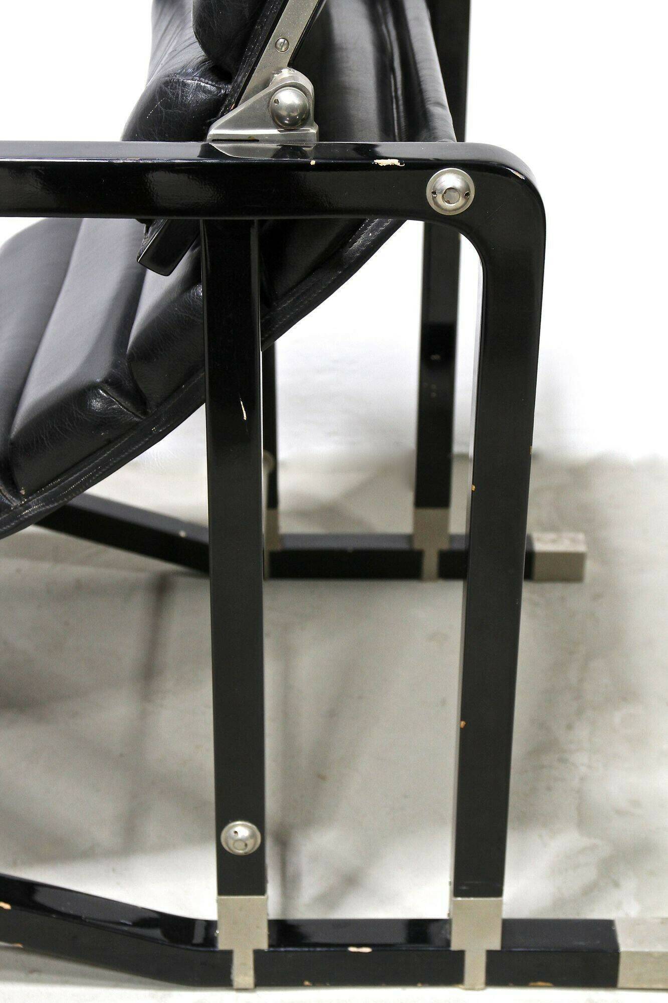 Black leather chaise longue, Eileen Gray design, 1927, France, circa 1975.