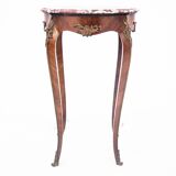 Table with a marble top, France, around 1910.