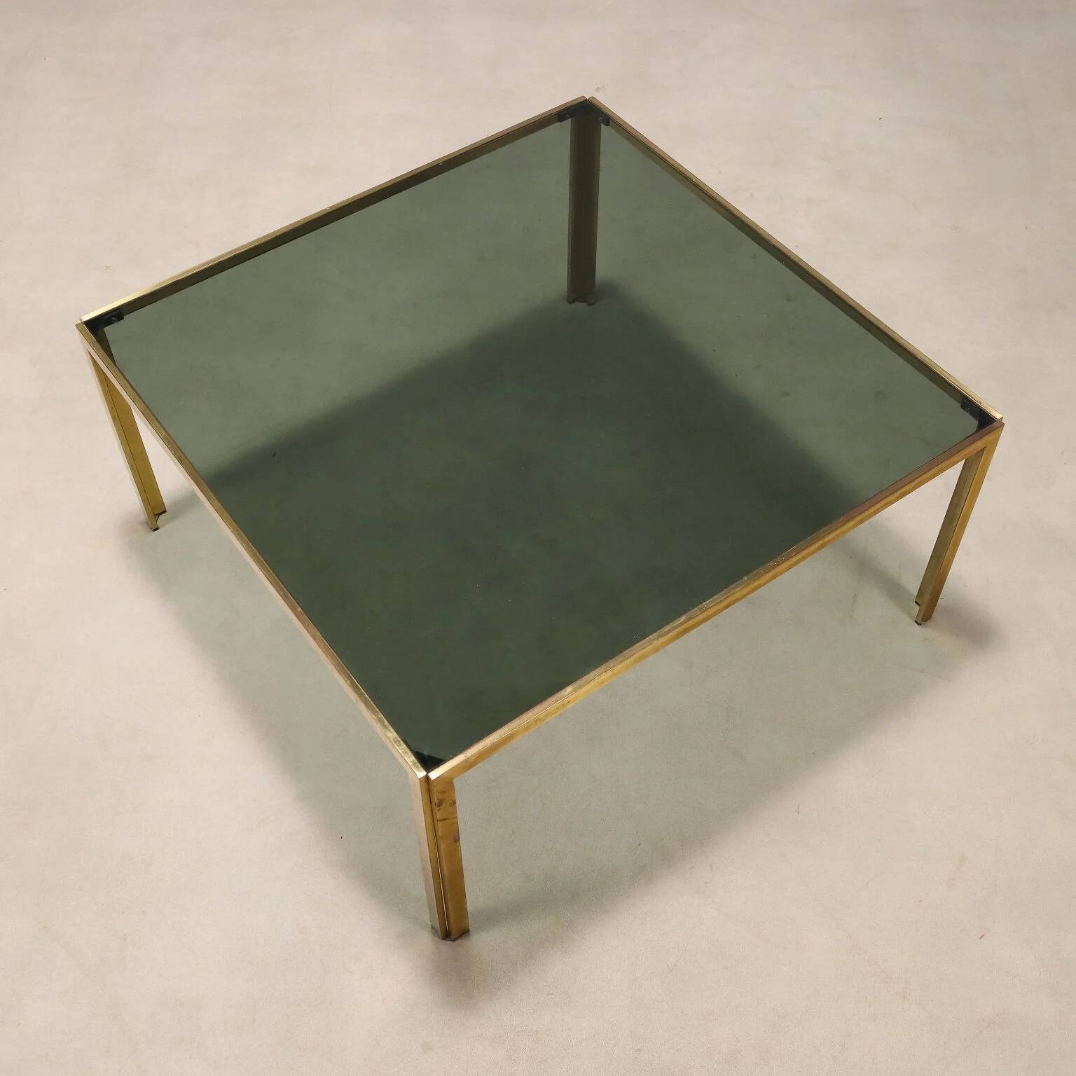 Vintage coffee table in brass and smoked glass, 1970s design.