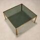 Vintage coffee table in brass and smoked glass, 1970s design.