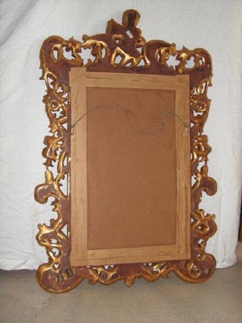 Imposant Miroir, bois sculpté doré, à décor de Putto