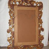 Imposing mirror, carved gilded wood, with Putto decoration