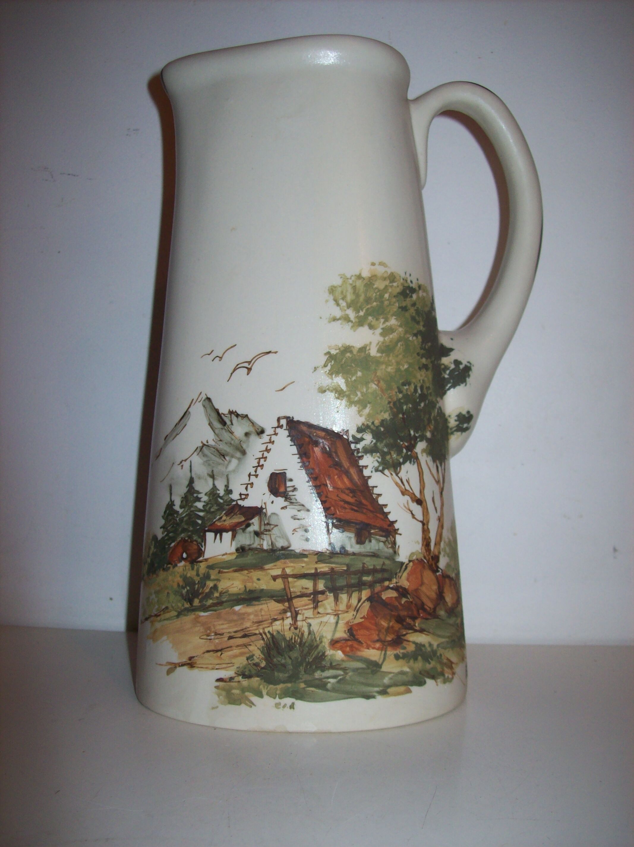 Ceramic pitcher with hand-painted decoration