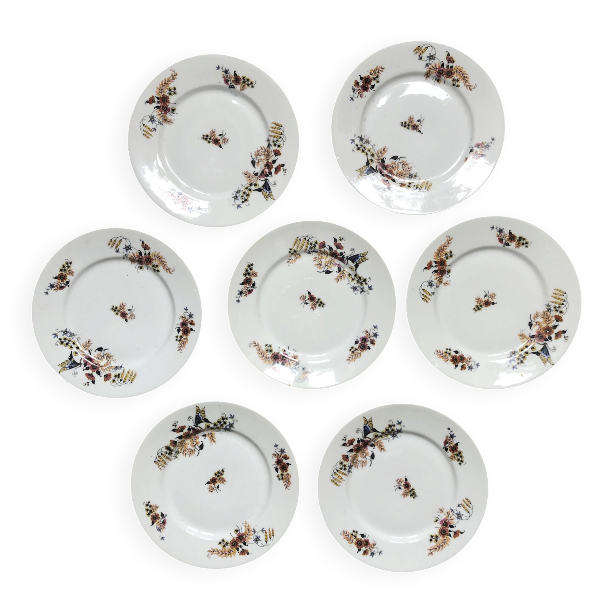 Set of 7 dessert plates in porcelain, butterfly pattern and wheat sheaves.