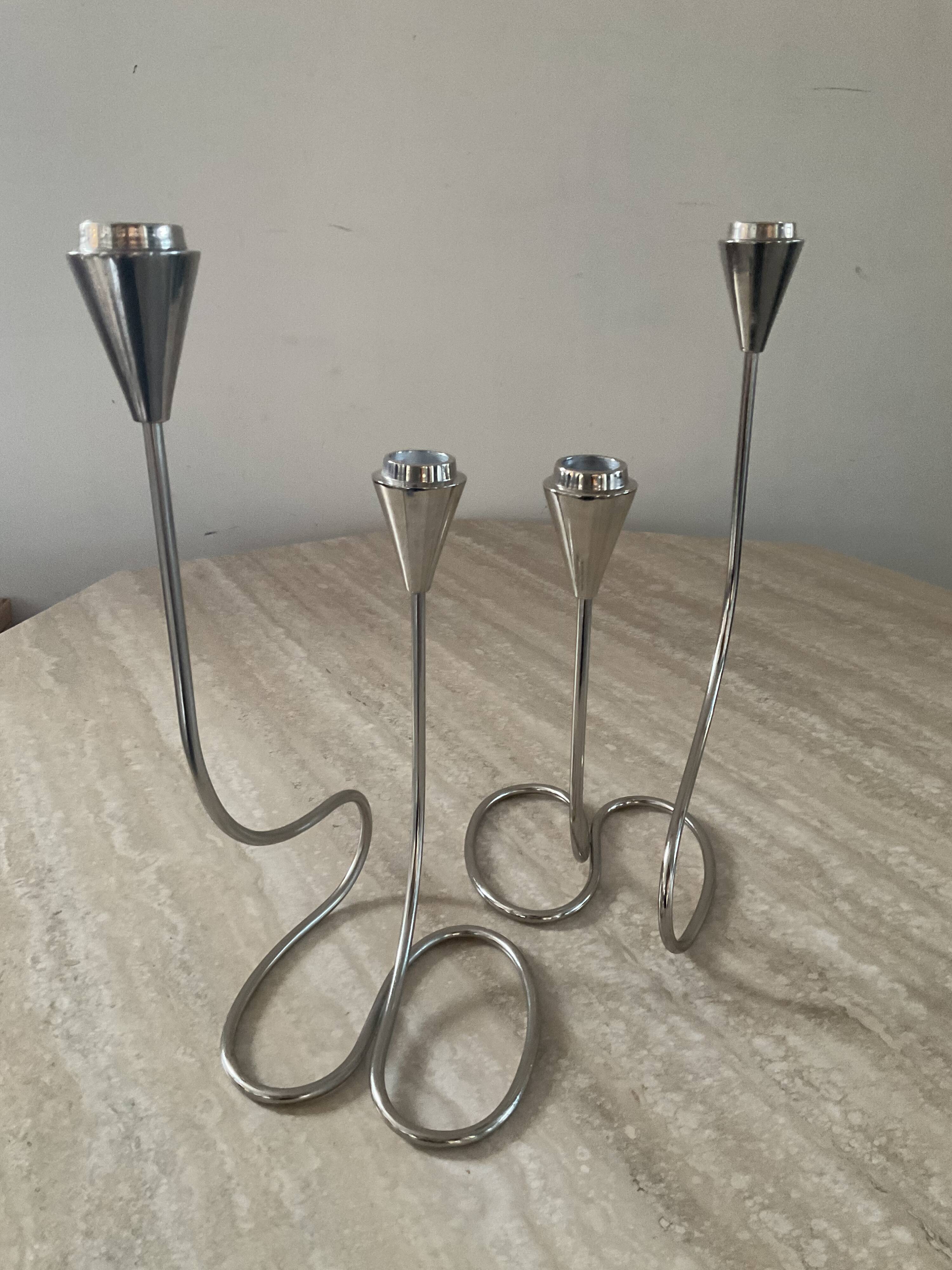 Pair of modernist silver metal candlesticks