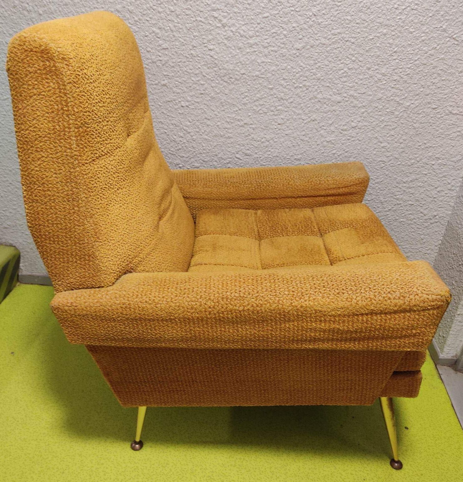 Old velvet heating chair on metal legs