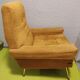 Old velvet heating chair on metal legs