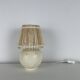 Vintage ceramic lamp with wicker and cotton shade.