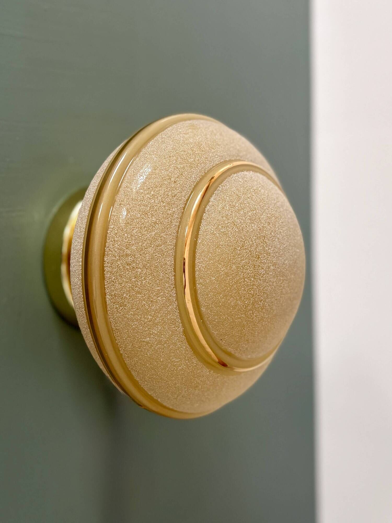 Vintage Art Deco globe wall/ceiling light in frosted yellow and gold glass.