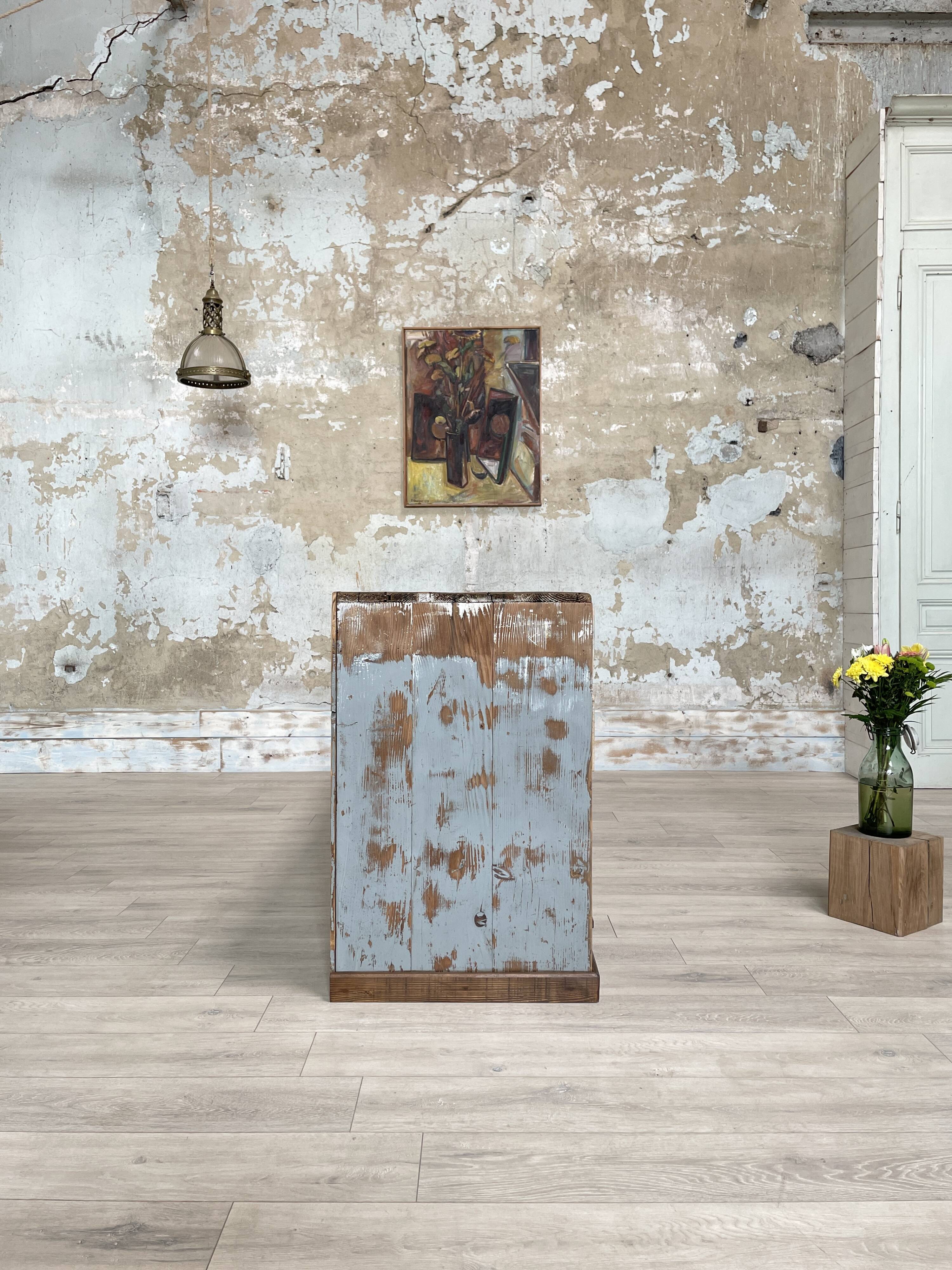 Artisanal workshop bank in patinated wood, circa 1950.