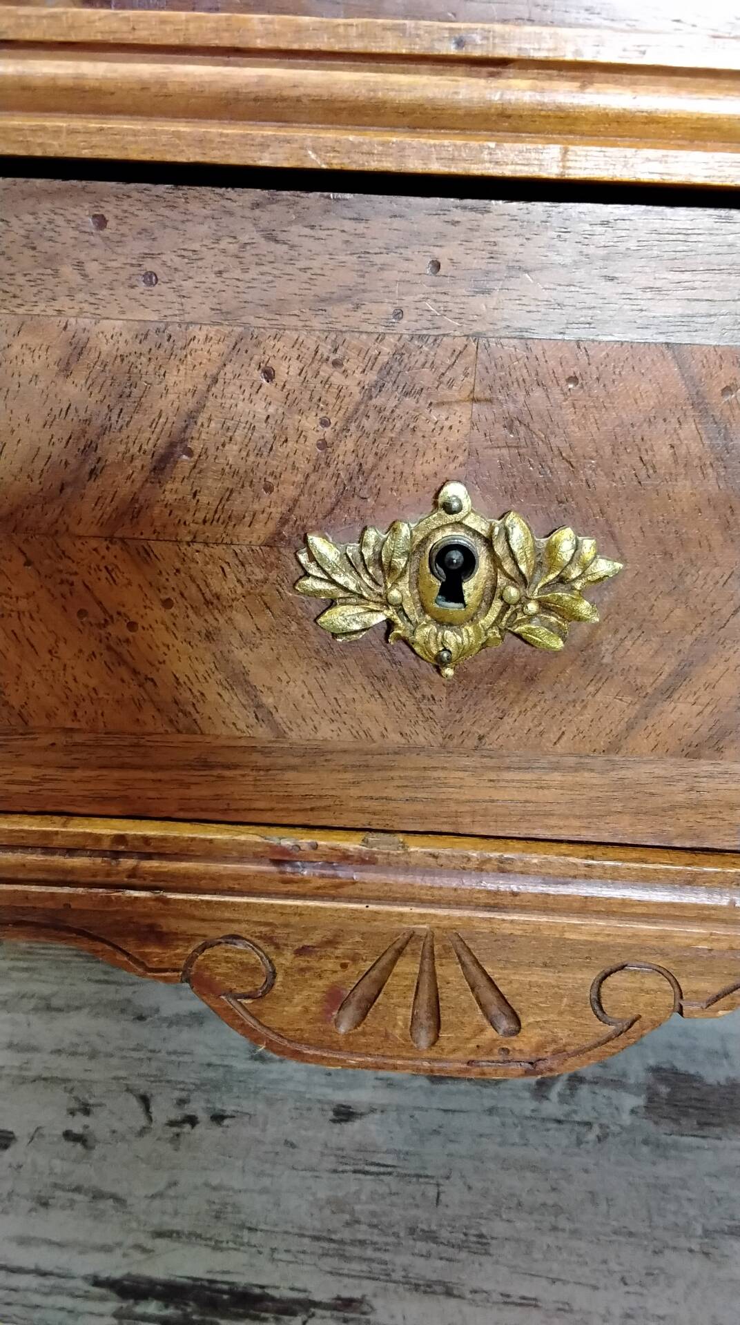 Antique marquetry commode in the Louis XVI style.