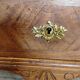 Antique marquetry commode in the Louis XVI style.