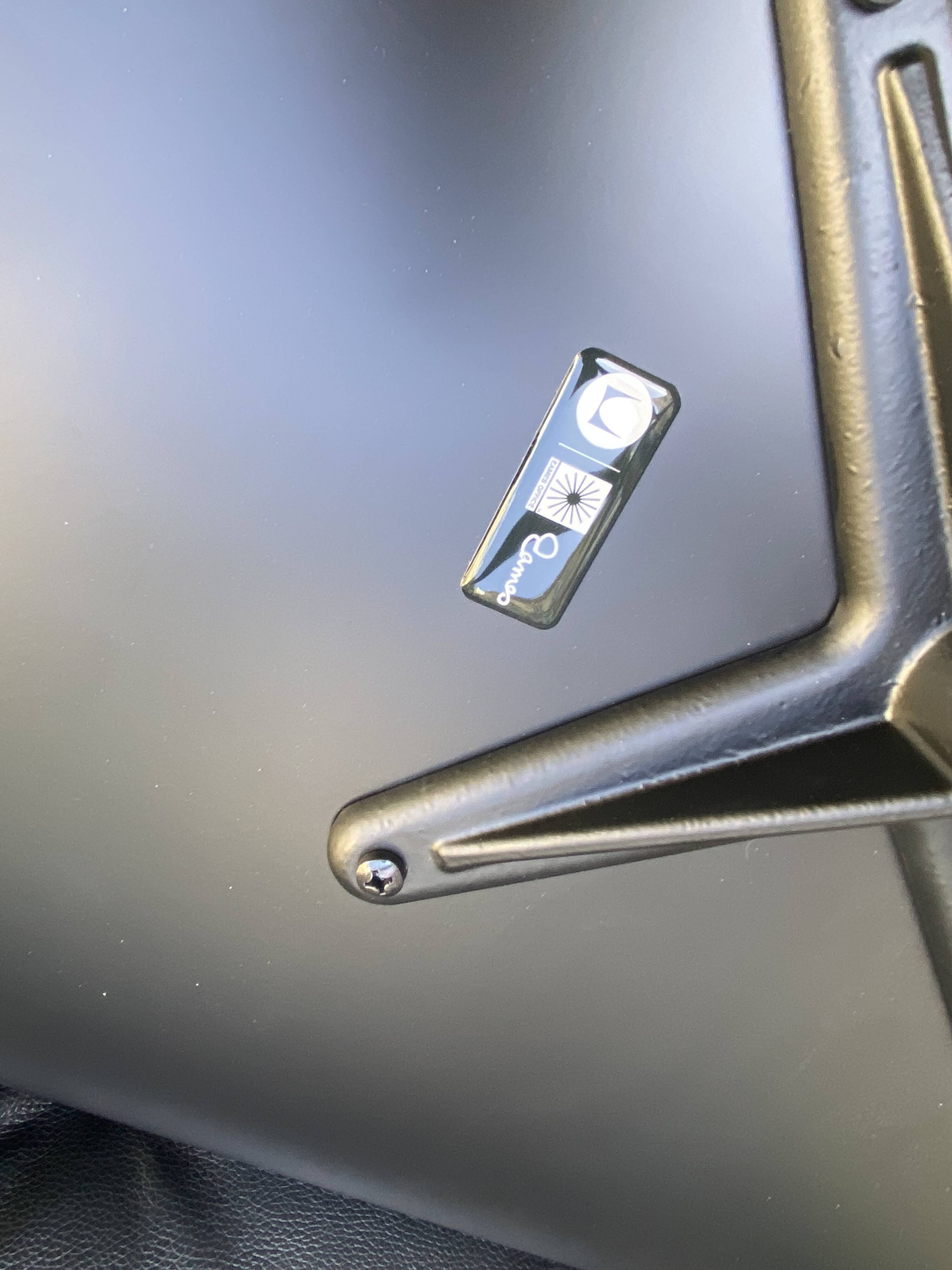 Charles Eames all-black lounge chair and ottoman, Herman Miller edition