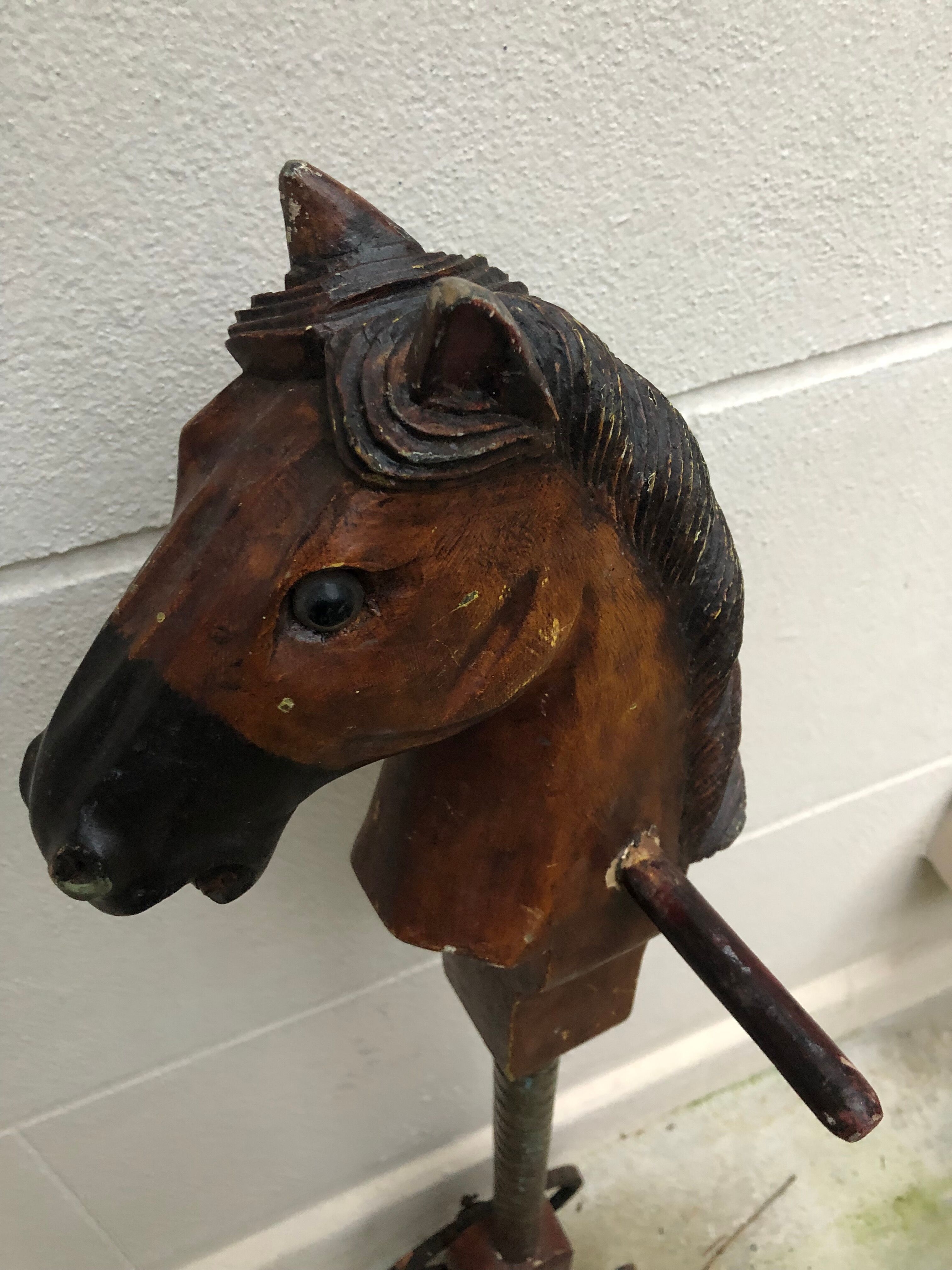 Wooden horse on stick