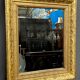Antique mirror in a baguette frame