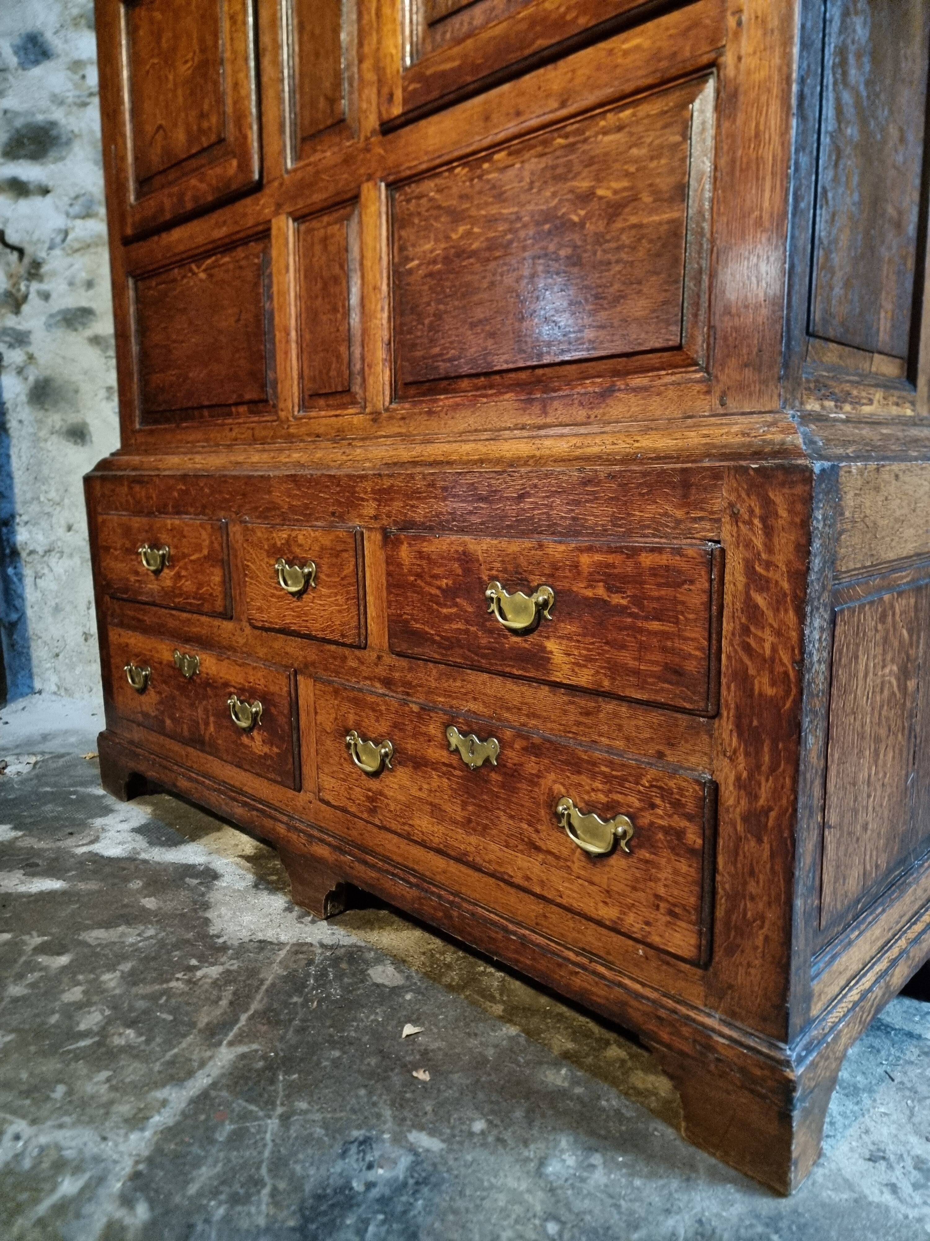 Antique English oak wardrobe with drawers, England, circa 1800–1820.