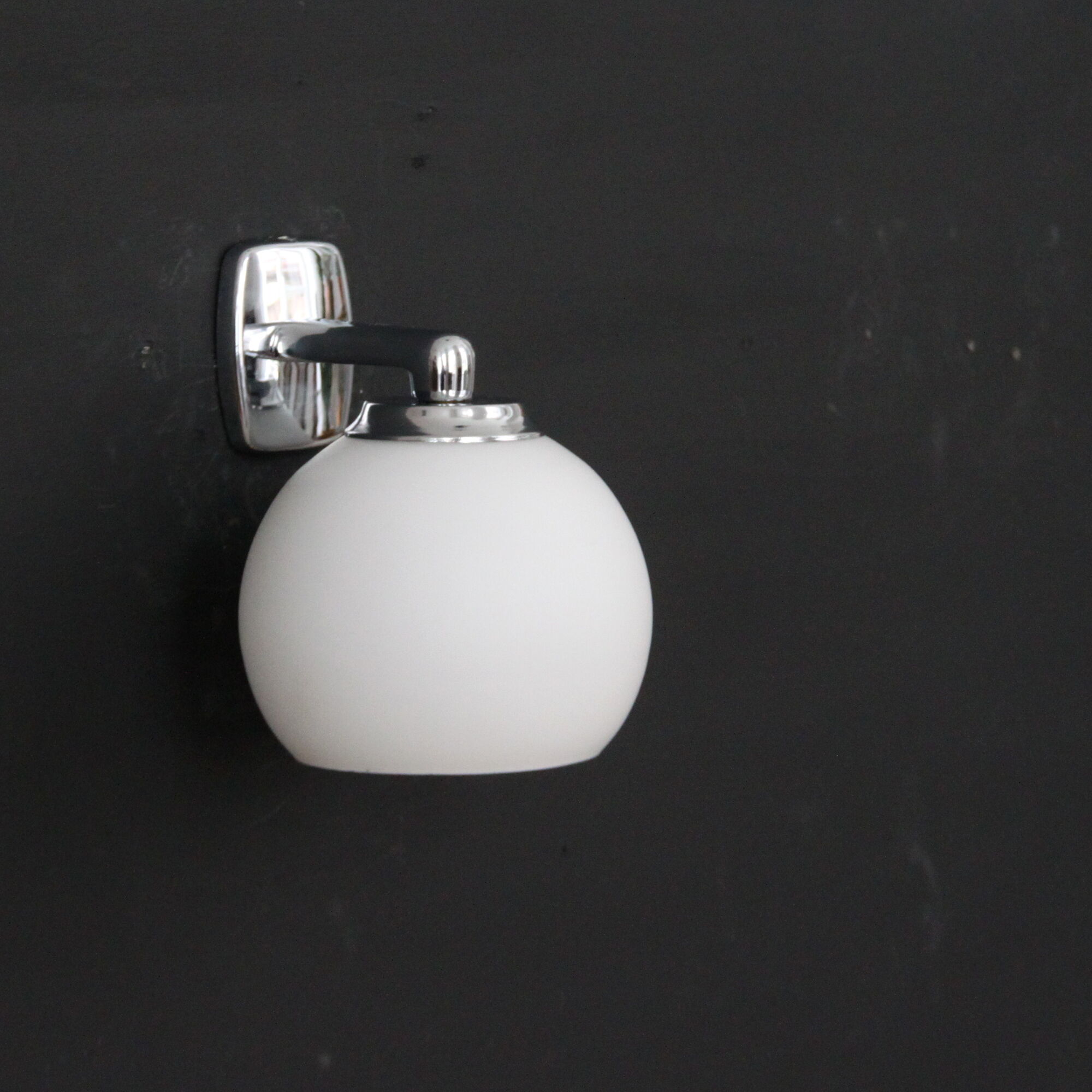 Pair of stainless steel and white glass wall sconces, seventies