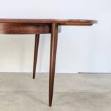 Round extendable wooden dining table