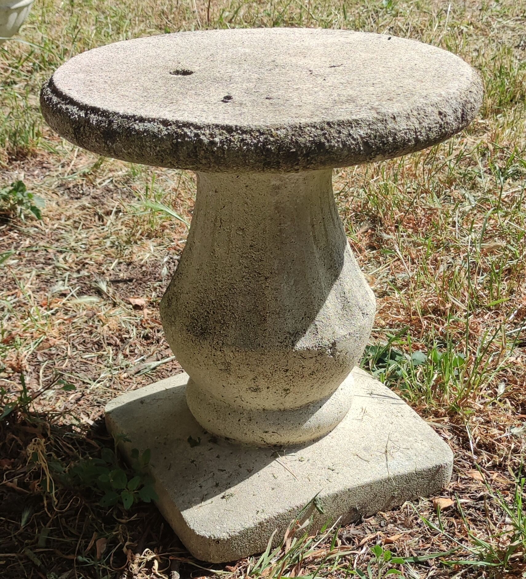 Old garden furniture in reconstituted stone