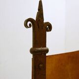 Curule armchair in wrought iron and leather