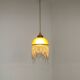 Vintage French amber mottled glass hanging ceiling light with beaded fringe.