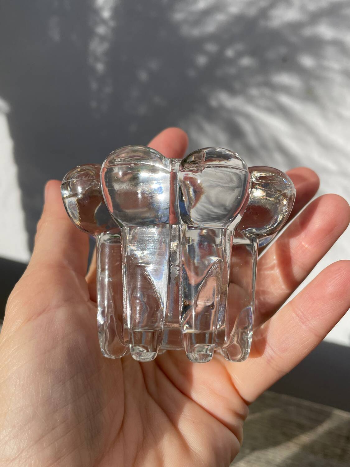 Trio of small, clear glass candle holders