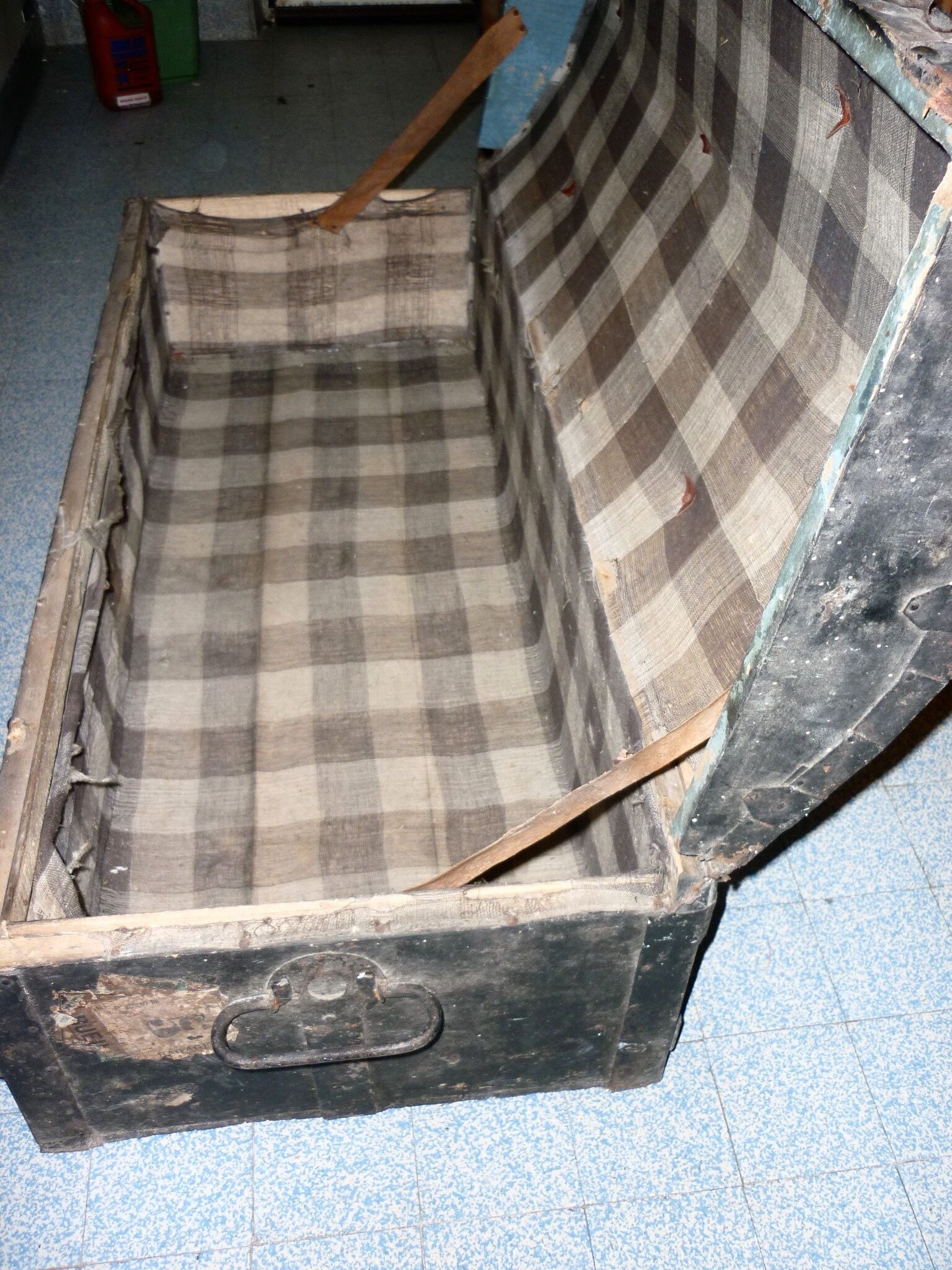Old bulging wooden travel trunk