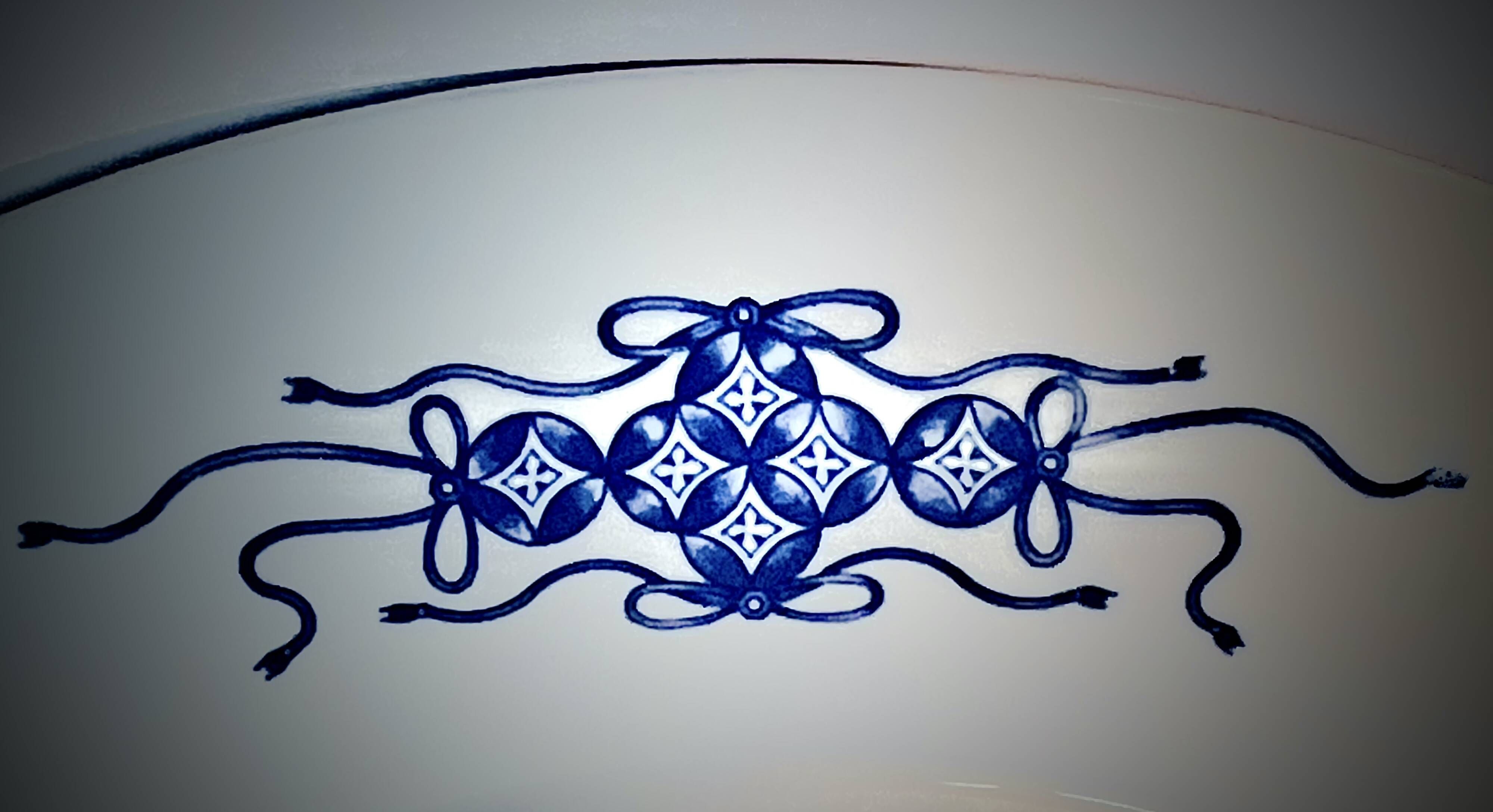 Decorative porcelain plate featuring a koi carp.