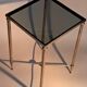 Gold brass side table in neoclassical style, circa 1960.