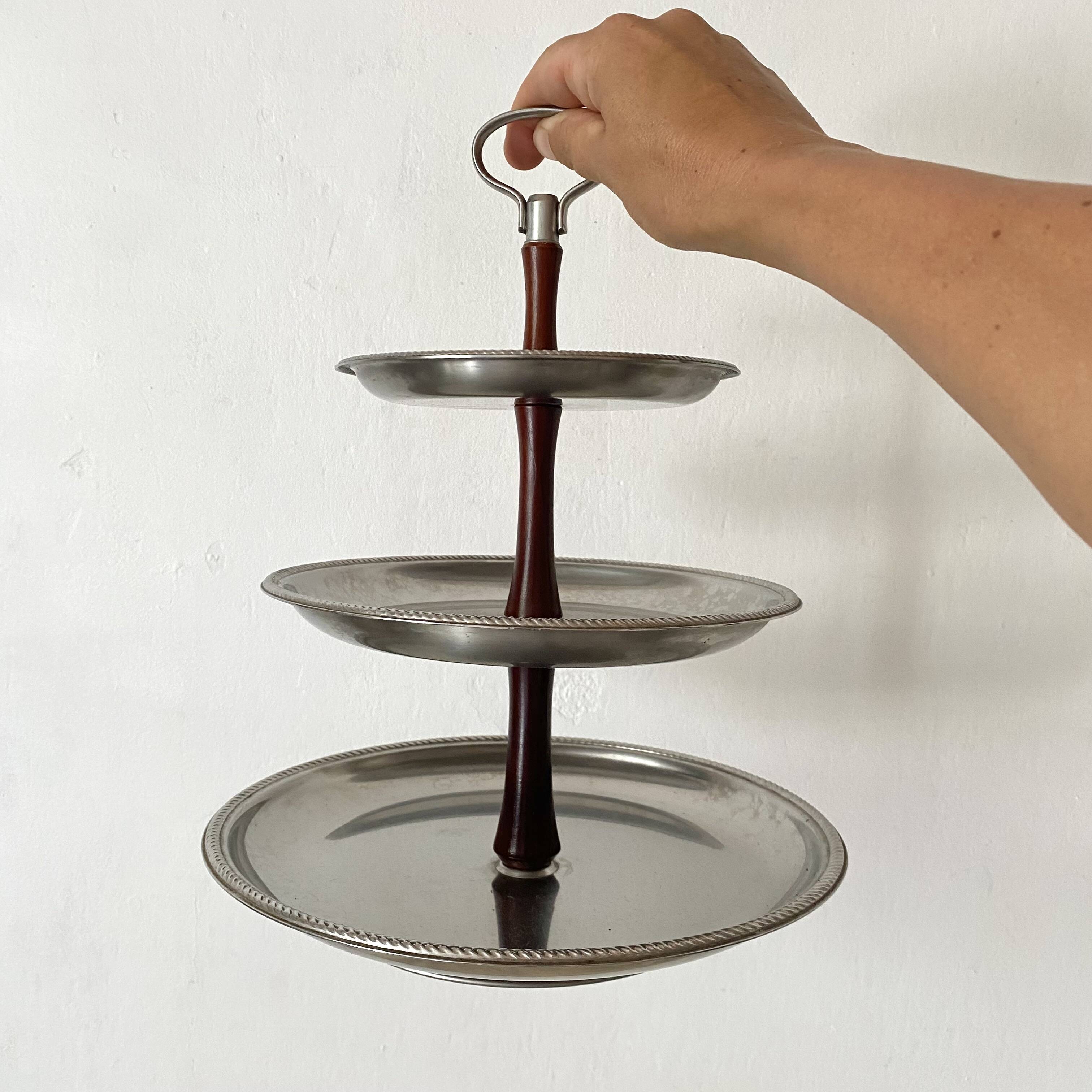 Vintage tiered display stand, stainless steel rotating server Alessi Fratelli