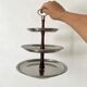 Vintage tiered display stand, stainless steel rotating server Alessi Fratelli