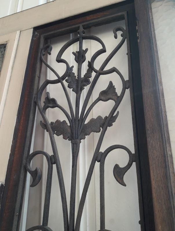 Old entrance door, glazed oak cast iron grilles 1925