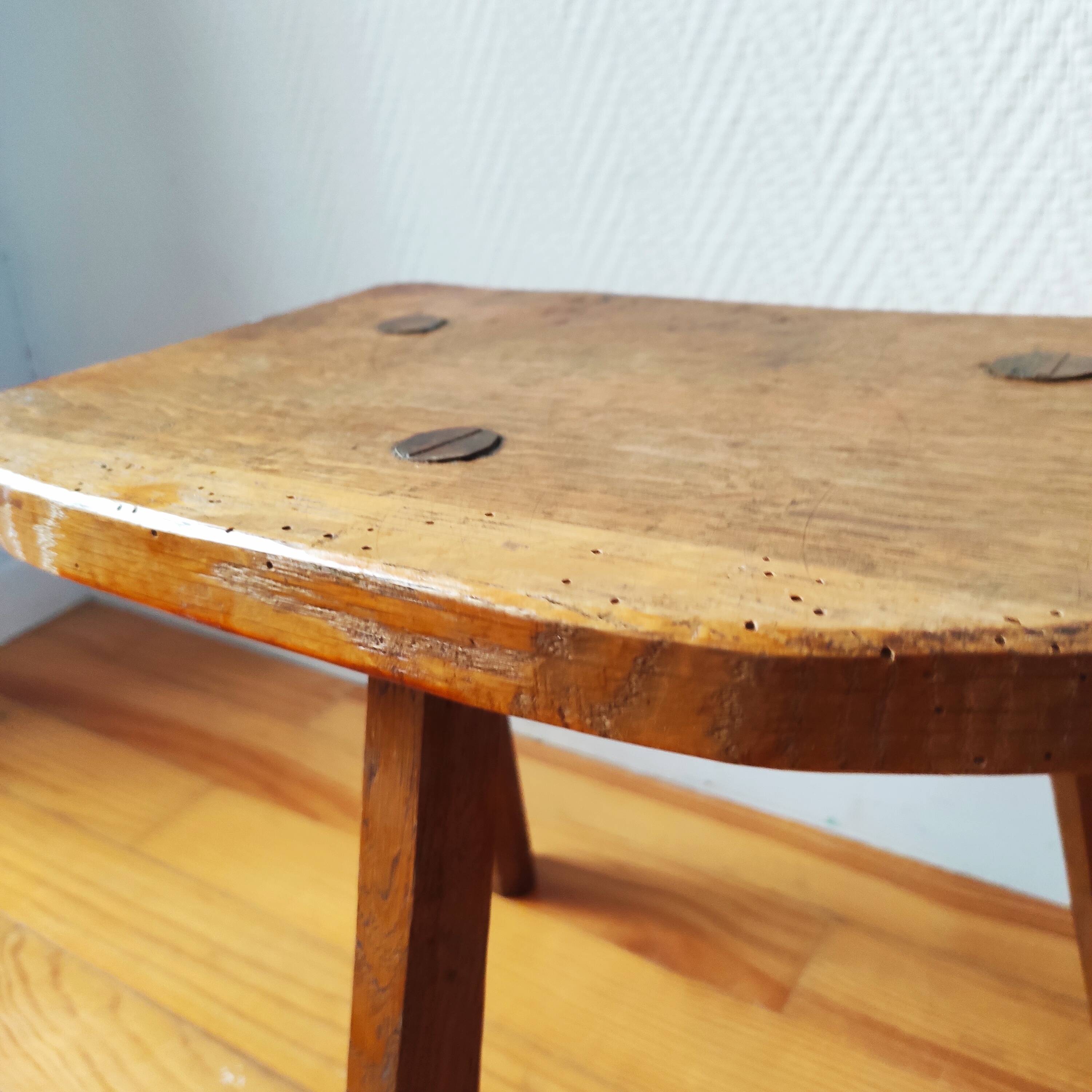 Pair of brutalist tripod stools in solid wood.