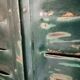 Lot of old green shutters in 4-part iron screen headboard