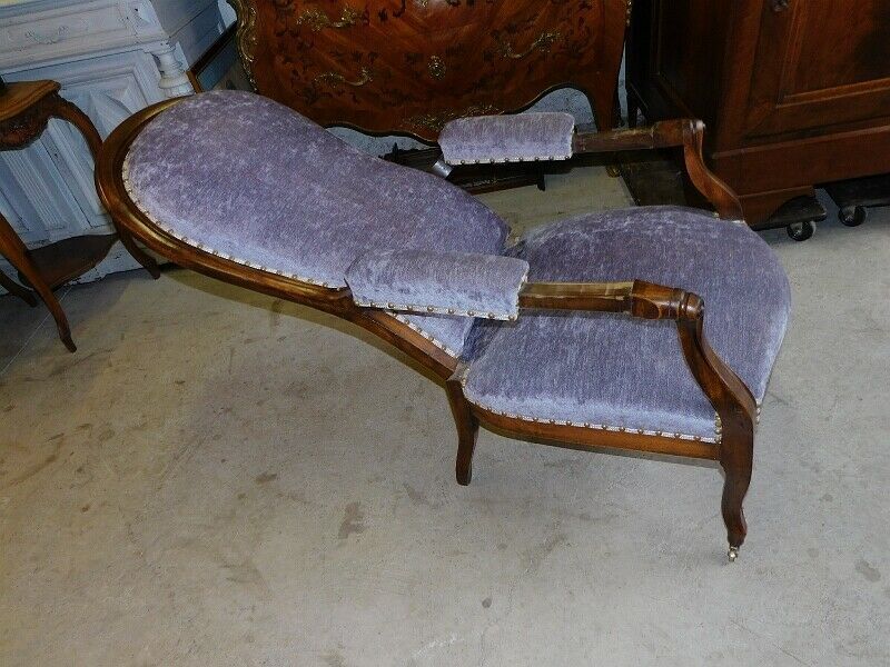 Relaxed Voltaire armchair with walnut racks