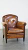 Sheep leather design armchair finished with decorative nails and black piping