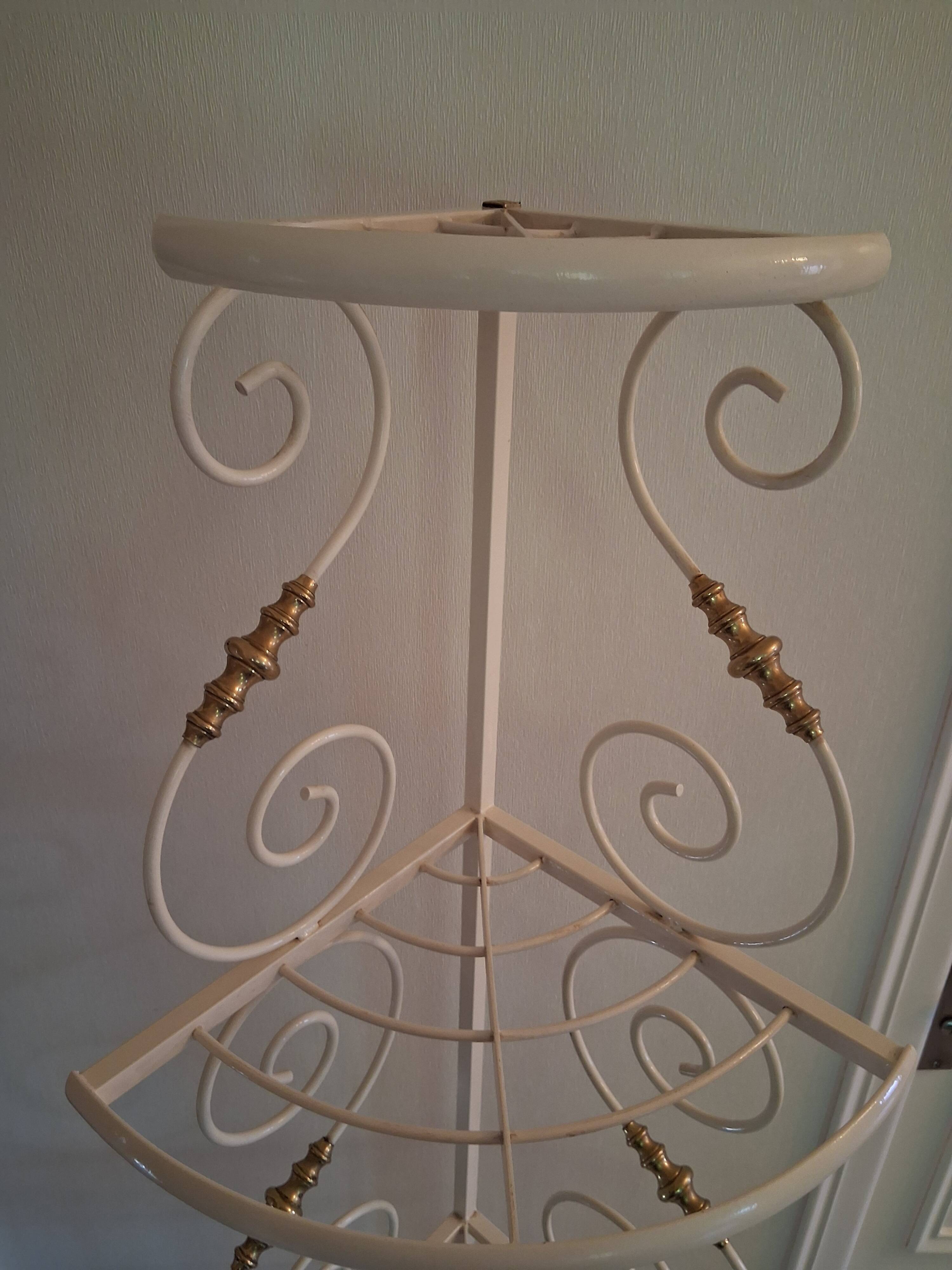 Cream and brass corner bakery shelf in wrought iron