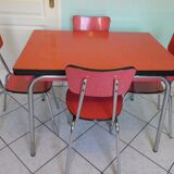 Table in red formica, 4 roc chairs, 2 extension cords, 2 drawers 60