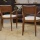 Pair of bridge armchairs in walnut and cream boucle fabric, early 20th century.