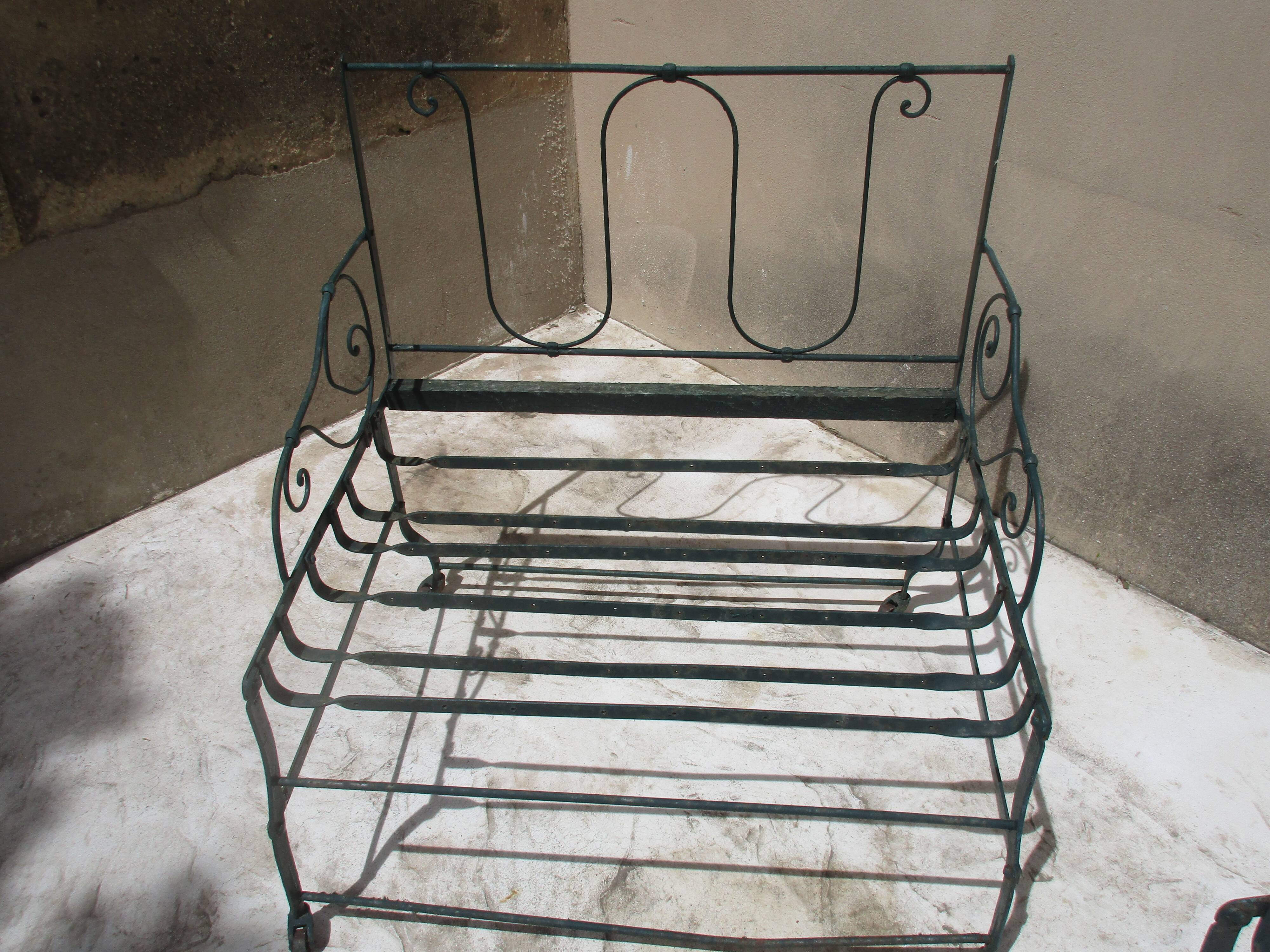Pair of iron garden chairs forge
