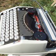 Baby hermes typewriter with manual job and his bag