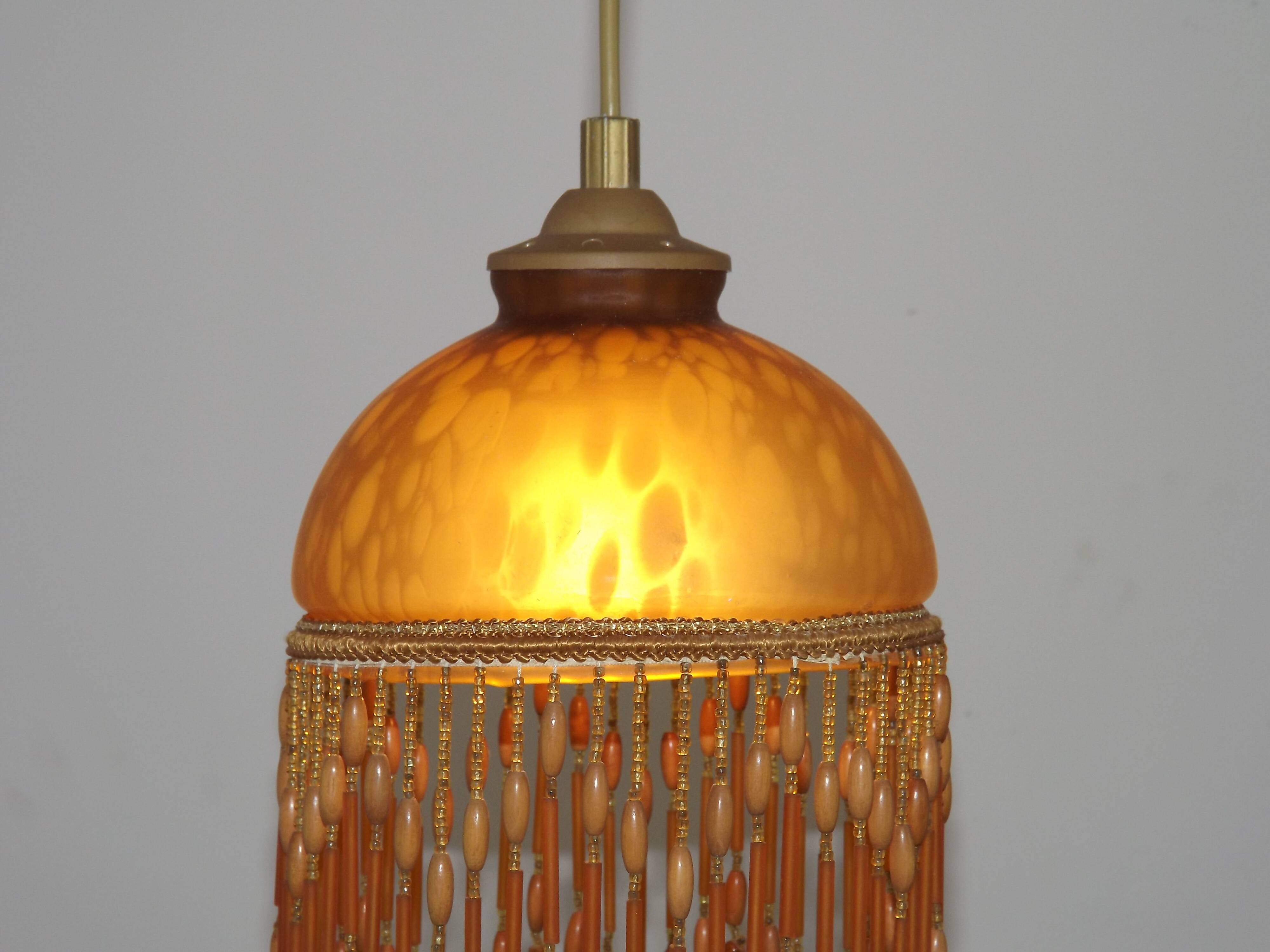 Vintage French amber mottled glass hanging ceiling light with beaded fringe.