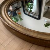 Old oval golden mirror