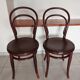 pair of round bistro chairs with a pattern on the seat, vintage