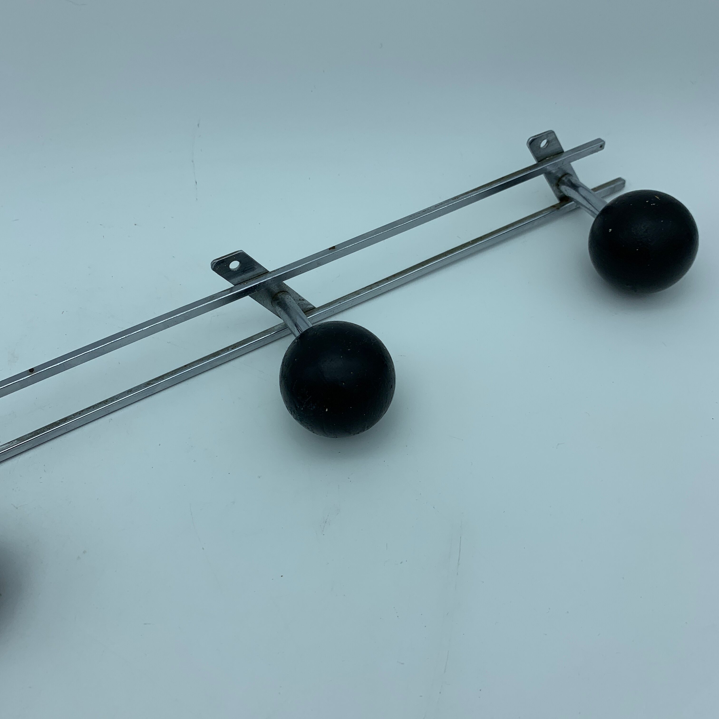 Coat holder 4 chrome steel pateres and black wooden balls