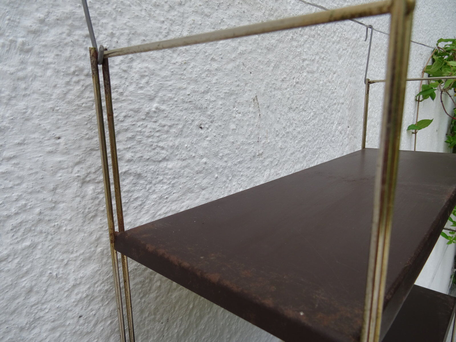 Metal string modular wall shelf