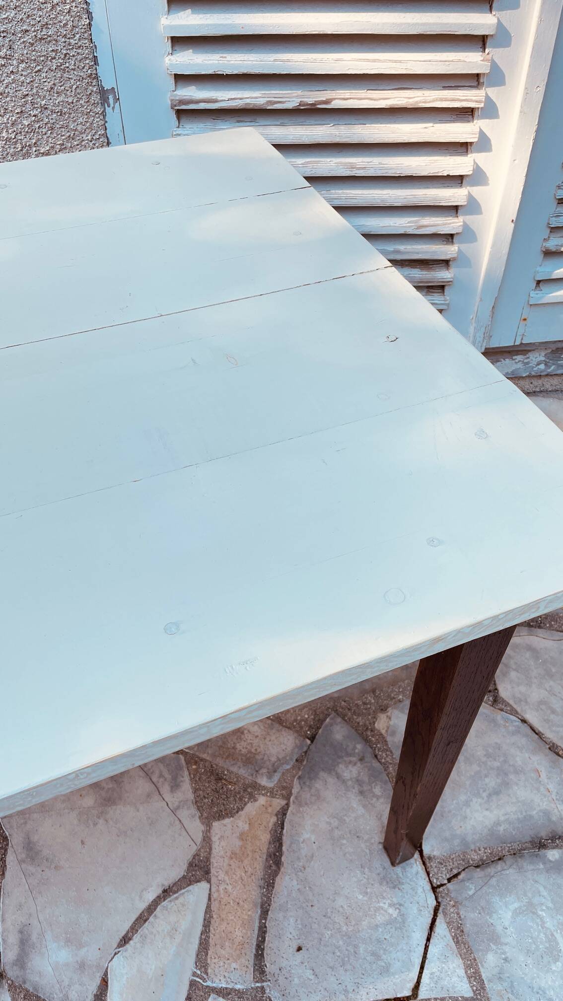 Vintage oak farmhouse table with a white top.