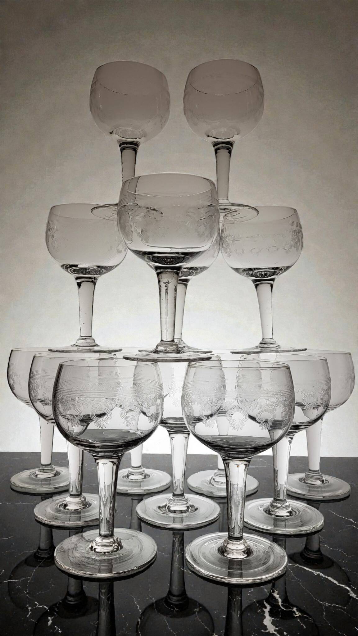 Page 4 of 8 9 guilloché wine glasses, early 20th century